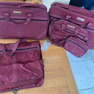 Oscar de la Renta Studio Designer Burgundy Luggage Set.